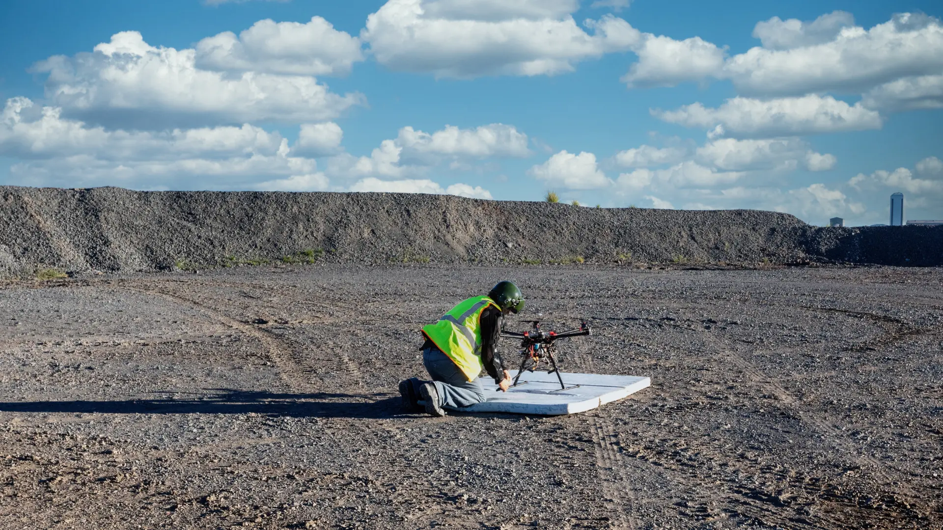 img of man setting up drone